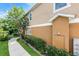 Side exterior showcasing landscaping and walkway along the building's facade at 1821 San Jacinto Cir, Sanford, FL 32771