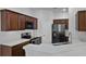 Modern kitchen with stainless steel appliances, white countertops and dark cabinetry at 1821 San Jacinto Cir, Sanford, FL 32771