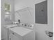 Convenient laundry room equipped with a modern washer and dryer set and wire shelving at 1821 San Jacinto Cir, Sanford, FL 32771