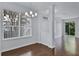 Bright living room featuring hardwood floors and a modern chandelier lighting fixture at 1821 San Jacinto Cir, Sanford, FL 32771