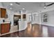 Open concept living space combining kitchen and living room with hardwood floors at 1821 San Jacinto Cir, Sanford, FL 32771