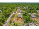 A cozy single story home has a shed, and is surounded by lush green foliage at 1898 9Th Ave, Deland, FL 32724