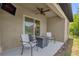 Cozy patio setup with stylish seating, a modern fire pit, and a mounted TV for ultimate relaxation at 1898 9Th Ave, Deland, FL 32724