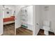 This bathroom showcases a shower with a charming, patterned curtain, complemented by a toilet at 1898 9Th Ave, Deland, FL 32724