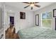 Comfortable bedroom with natural light, hardwood floors, ceiling fan, and relaxing decor at 1898 9Th Ave, Deland, FL 32724