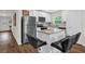 Modern kitchen with stainless steel appliances, granite countertops, and a central island at 1898 9Th Ave, Deland, FL 32724