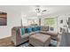 Spacious living room with plush sectional, and sliding glass doors to backyard at 1898 9Th Ave, Deland, FL 32724