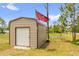 Durable metal storage shed in the yard, perfect for storing tools and equipment at 1898 9Th Ave, Deland, FL 32724