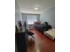 The bedroom is equipped with laminate flooring and two beds, perfect for multiple children at 204 Terrace Ridge Cir # 204, Davenport, FL 33896