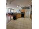 Well-maintained kitchen with tiled floors, wooden cabinets, and an open view to the living area at 204 Terrace Ridge Cir # 204, Davenport, FL 33896