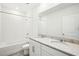 Modern bathroom featuring double sinks, granite countertop, and shower and tub combination at 2141 Rosewood Dr, Bartow, FL 33830