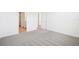 Clean bedroom with plush carpet, white walls, and views to connected rooms at 2141 Rosewood Dr, Bartow, FL 33830