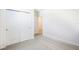 Cozy bedroom with neutral carpet and ample closet space for optimal storage at 2141 Rosewood Dr, Bartow, FL 33830