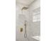Modern bathroom featuring gorgeous marble tile, gold fixtures and a rainfall shower head at 2327 Fieldingwood Rd, Maitland, FL 32751