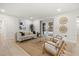 Bright living room with light-colored wood floors and doors to patio at 2327 Fieldingwood Rd, Maitland, FL 32751