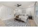 Well-lit main bedroom featuring a ceiling fan, neutral decor, and an en-suite bathroom at 2327 Fieldingwood Rd, Maitland, FL 32751