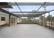 Enclosed patio with screened walls, overhead covering, and concrete flooring extends outdoor living space at 2327 Fieldingwood Rd, Maitland, FL 32751