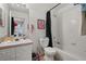 A full bathroom featuring a shower-tub combo, commode, and vanity with sink at 242 Coco Plum Dr, Davenport, FL 33897