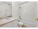 Bathroom featuring a shower-tub combo, a white sink with a vanity and a toilet at 242 Coco Plum Dr, Davenport, FL 33897