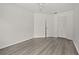 Bedroom featuring a closet, laminate wood flooring and neutral paint to easily accommodate decor and furniture at 242 Coco Plum Dr, Davenport, FL 33897