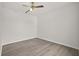 Bedroom featuring a ceiling fan, laminate wood flooring and neutral paint to easily accommodate decor and furniture at 242 Coco Plum Dr, Davenport, FL 33897