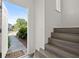 Light and airy foyer featuring stairs and front door with a view of the outside at 242 Coco Plum Dr, Davenport, FL 33897