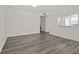 Bright living room with wood floors and fresh, neutral paint at 242 Coco Plum Dr, Davenport, FL 33897