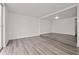 Open living area with neutral paint and wood flooring at 242 Coco Plum Dr, Davenport, FL 33897