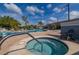 A view of the community pool and jacuzzi with an inviting atmosphere at 242 Coco Plum Dr, Davenport, FL 33897