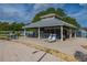 Outdoor recreation area featuring a covered pavilion with seating, picnic tables, and lounge chairs for relaxation at 242 Coco Plum Dr, Davenport, FL 33897