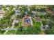 Beautifully landscaped property featuring a pool, detached garage, and front yard at 2420 Heron Ct, St Cloud, FL 34769