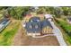 Expansive backyard featuring a screened pool, detached garage, and pristine landscaping at 2420 Heron Ct, St Cloud, FL 34769