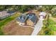 Inviting home featuring a screened pool, detached garage, and a well-maintained front yard at 2420 Heron Ct, St Cloud, FL 34769