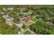 Landscaped property featuring a pool, detached garage, with mature trees surrounding the neighborhood at 2420 Heron Ct, St Cloud, FL 34769