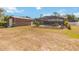 Metal garage, backyard and screened-in pool in the back of the house at 2420 Heron Ct, St Cloud, FL 34769