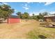 Backyard showing shed, fence and utility buildings at 2420 Heron Ct, St Cloud, FL 34769