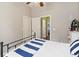 This bedroom offers a cozy retreat, complete with ceiling fan, natural light, and closet access at 2420 Heron Ct, St Cloud, FL 34769