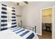 This bedroom features a closet and a view of the window, with nautical-themed accents at 2420 Heron Ct, St Cloud, FL 34769
