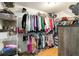 This walk-in closet has metal organizers, shoe racks, and lots of room for clothes at 2420 Heron Ct, St Cloud, FL 34769