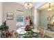 Bright dining area with a glass table, comfortable seating, and stylish decor at 2420 Heron Ct, St Cloud, FL 34769