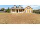 Beautiful two-story home featuring a covered front porch and classic design elements at 2420 Heron Ct, St Cloud, FL 34769