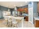 Charming kitchen boasts granite countertops, stainless steel appliances, and an island with seating at 2420 Heron Ct, St Cloud, FL 34769