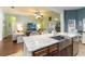 Open concept kitchen with stainless steel appliances and views into the living room at 2420 Heron Ct, St Cloud, FL 34769