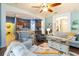 Open-concept living room flows into the kitchen with an eat-in bar for easy socializing and dining at 2420 Heron Ct, St Cloud, FL 34769