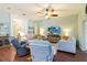 Bright and airy living room featuring comfortable seating and a ceiling fan for relaxed, casual living at 2420 Heron Ct, St Cloud, FL 34769