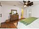 This main bedroom features wood floors, a modern ceiling fan, and plenty of storage at 2420 Heron Ct, St Cloud, FL 34769