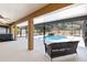 Inviting screened patio with a refreshing pool and rock waterfall feature for outdoor relaxation at 2420 Heron Ct, St Cloud, FL 34769