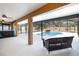 Screened patio showcasing a beautiful pool with a rock waterfall feature, perfect for outdoor living at 2420 Heron Ct, St Cloud, FL 34769
