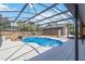 A gorgeous screened pool with waterfall feature and backyard shed at 2420 Heron Ct, St Cloud, FL 34769