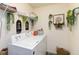 Well-organized laundry room featuring storage shelves and decor at 2420 Heron Ct, St Cloud, FL 34771